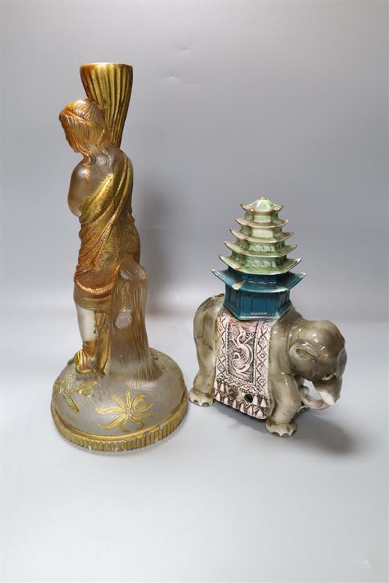 A late Victorian painted moulded glass candlestick, height 29cm, and a Rosenthal porcelain ceremonial elephant model, 19cm
